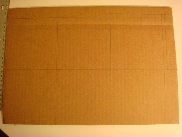 Cardboard sheet with grid lines drawn for box design
