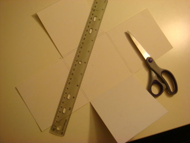 Paper template being cut using scissors