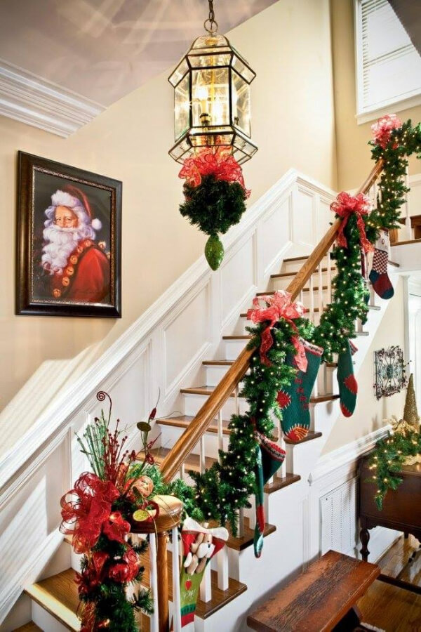 Staircase Decoration with ribbon, leaves, and shocks for Christmas
