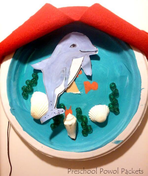 Dolphins puppets and paper plate ocean