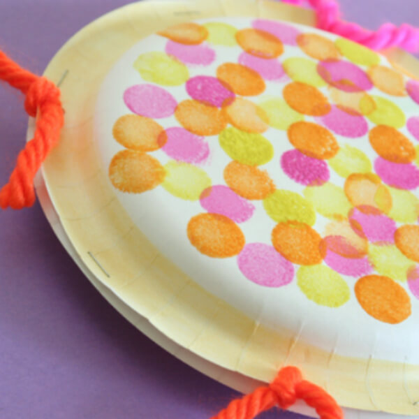 Super Fun Tambourine Made Using  Beans-Filled Paper Plates