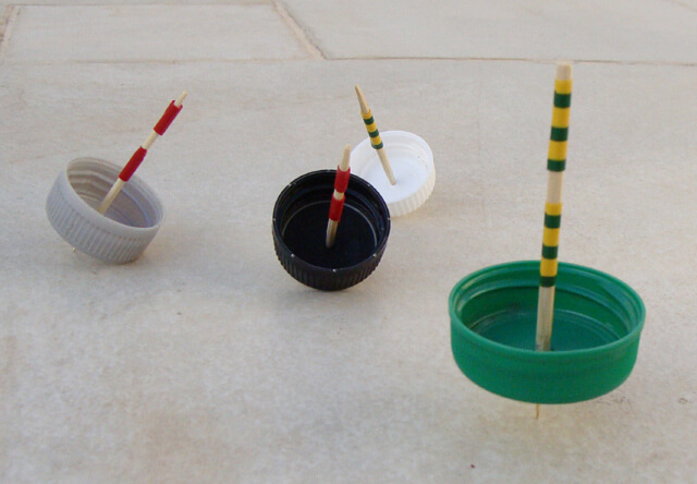 DIY Spinning Tops Made From Plastic Bottle Caps Recycled plastic bottle toy ideas