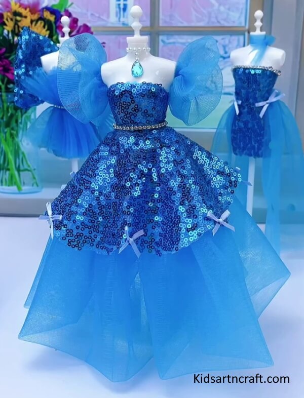 Beautiful Blue Net Gown For Girls Barbie Doll with Shoulder Frill and Embroidery