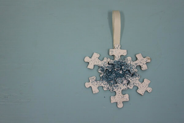 Easy To Make Glittery Snowflake Craft With Puzzle Pieces Recycled Christmas Ornaments