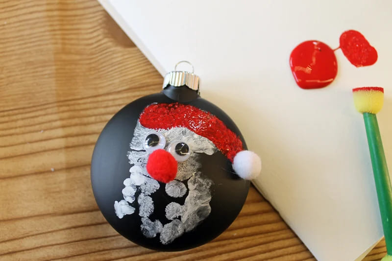 Santa Claus Craft Made With Baby Hand on Black Disk Ornament