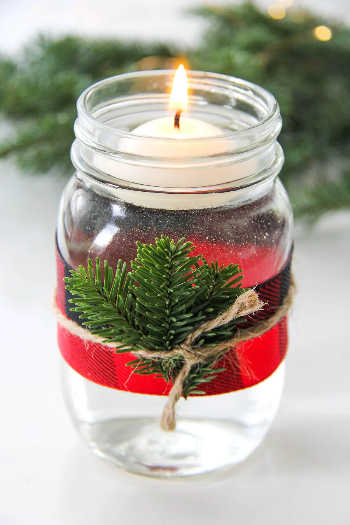 Mason Jar Candle Holder With Floating Candles & Evergreen Sprigs Gorgeous DIY Christmas Candles