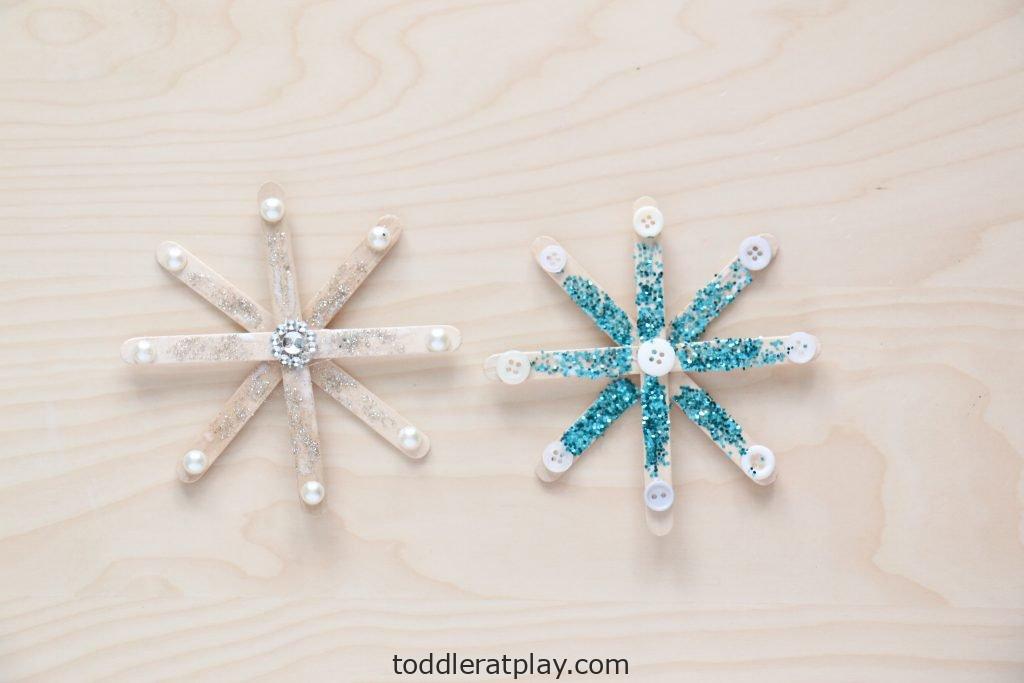 Adorable Popsicle Stick Snowflake Craft Activity With Glitter & Buttons