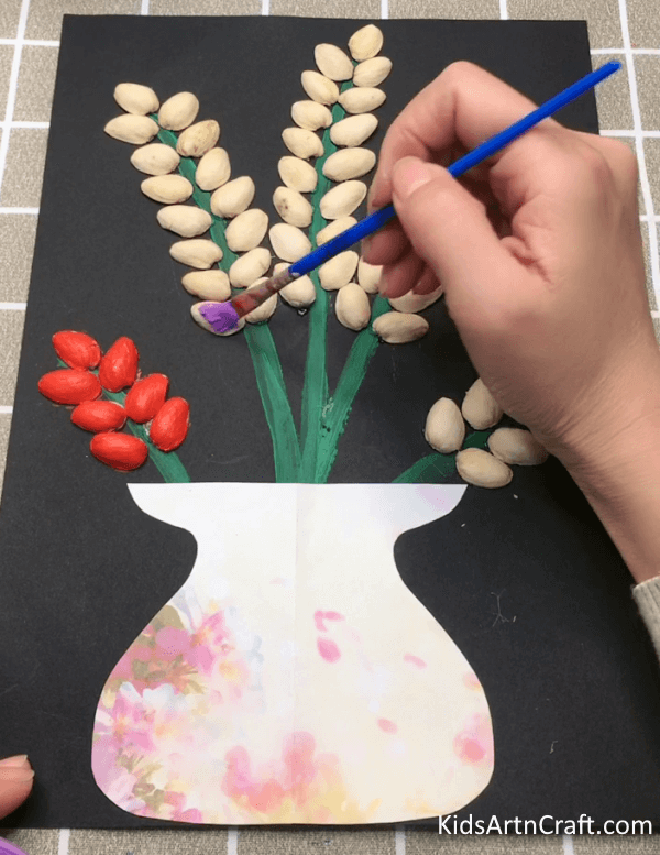 A Colorful Art Of Painting To Make Pista Shells Flower Craft Idea For Kids