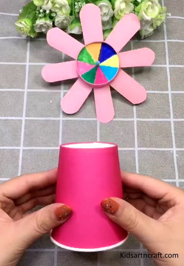 A Paper Cup Is Used To Make Spinning Toy Craft Idea For Kids