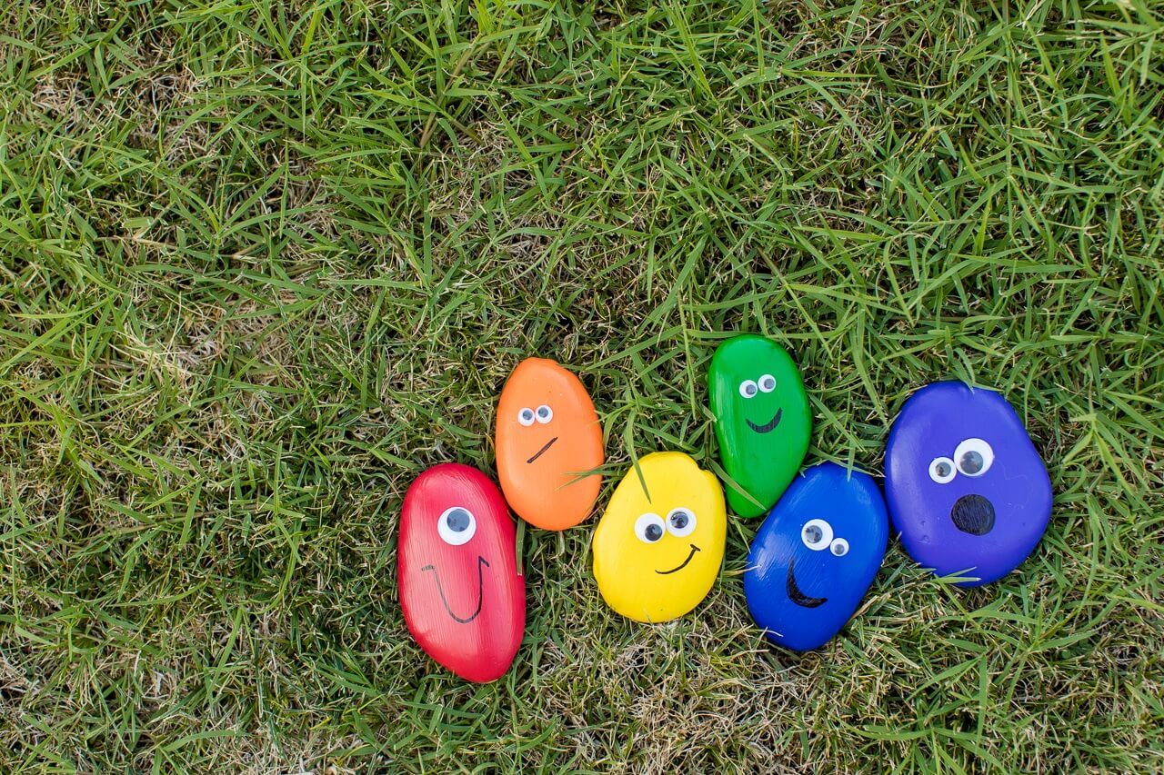Different Pet Rocks Painted In Rainbow Colors