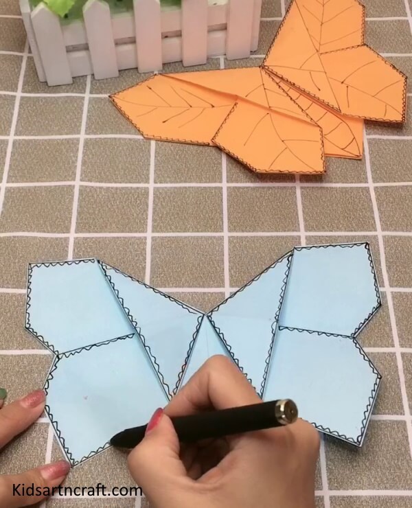 Beautiful Designing on The Boarders Of The Origami Paper Butterfly 