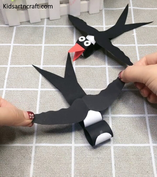 Pasting Wings Of Swallow Bird Made Of Paper Craft For Kids