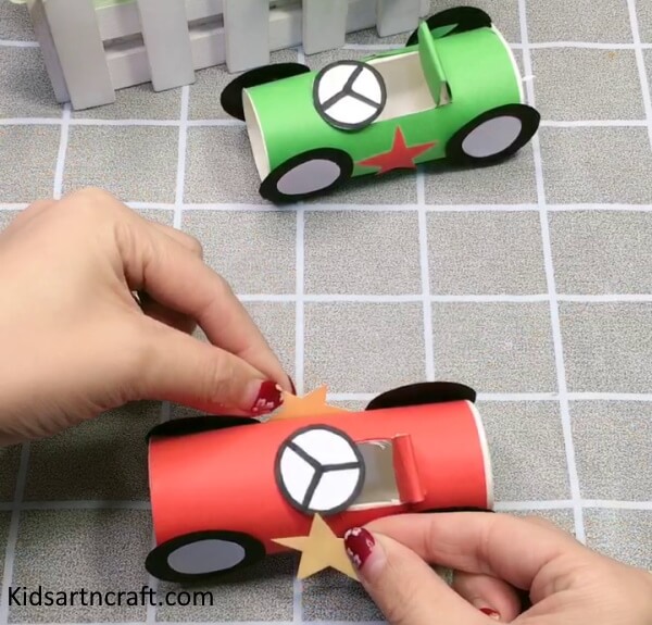 Adding Little Stars On Paper Cup Race Car Craft For Kids