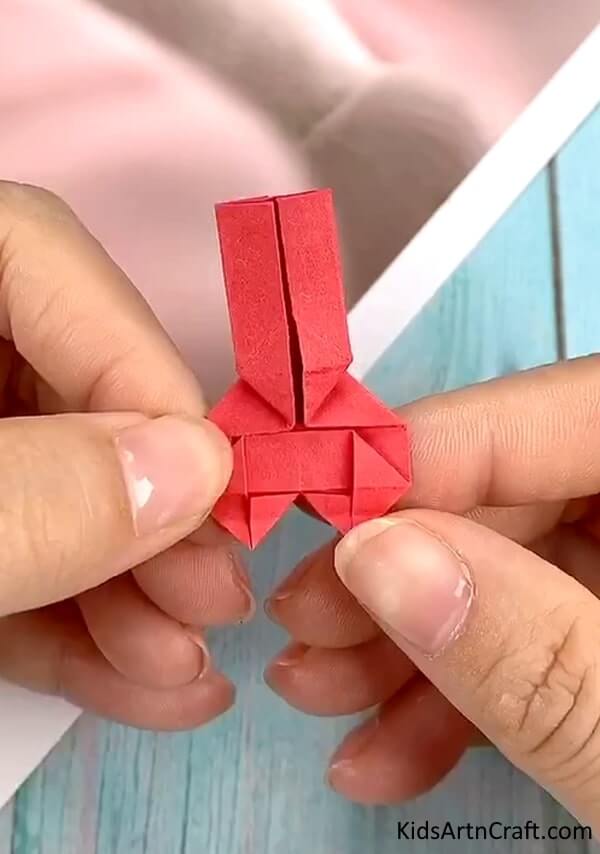 Art Process Of Origami Paper To Make Bracelet Craft For Kids