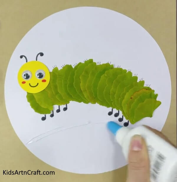  Create a wonderful butterfly and sunshine craft using foliage, paper, and wiggly eyes - Lovely Caterpillar And Sun Craft With Leaves