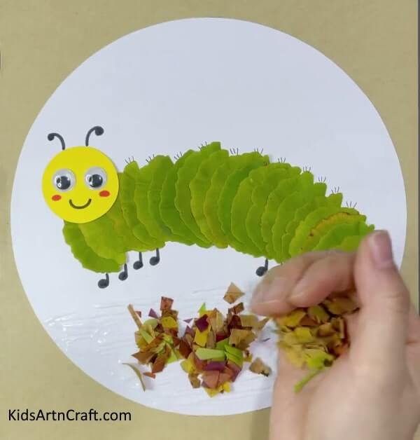 Make a charming caterpillar and sun craft with leaves, paper, and google eyes - Lovely Caterpillar And Sun Craft With Leaves