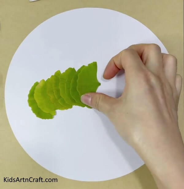 A delightful caterpillar and sun craft that uses leaves, paper, and googly eyes - Lovely Caterpillar And Sun Craft With Leaves