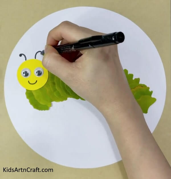 An exquisite caterpillar and sun craft fashioned with leaves, paper, and googly eyes - Lovely Caterpillar And Sun Craft With Leaves