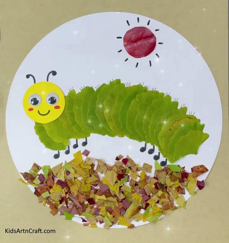 Give life to an exquisite caterpillar and sun craft using leaves, paper, and wiggly eyes - Lovely Caterpillar And Sun Craft With Leaves