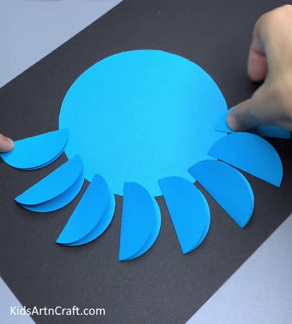Pasting The 8 Legs - Learn to Create a Blue Paper Octopus