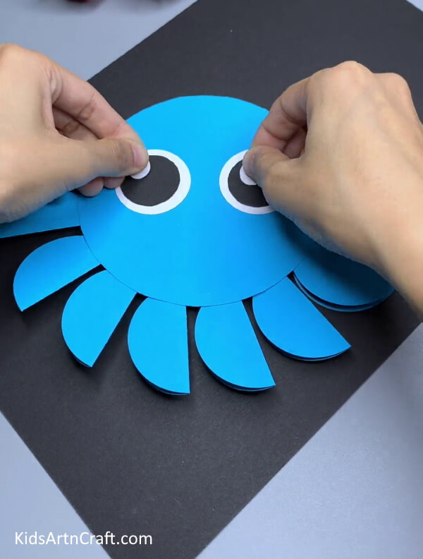 Paste White Circle On Black Eyes - Step-by-Step Guide to Making a Blue Paper Octopus