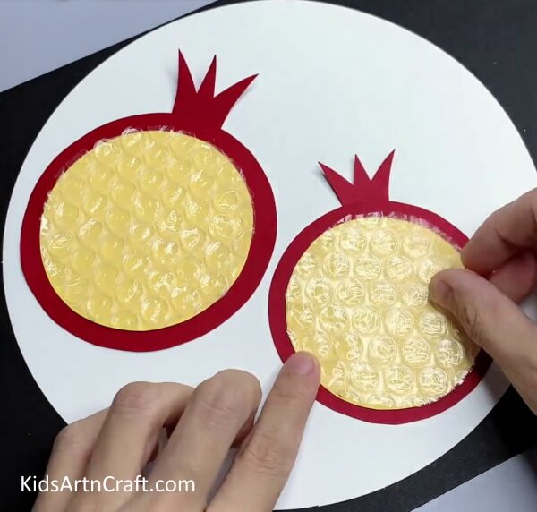 Covering Other Yellow Circle With Bubble Wrap - A Fun Way To Make Pomegranate Art With Bubble Wrap - For Kids! 