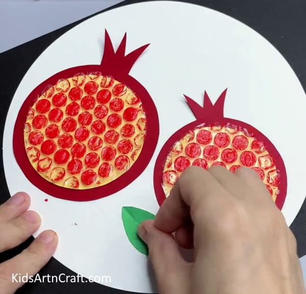 Pasting Leaves - Youngsters Can Have Fun Crafting Pomegranate Art With Bubble Wrap 
