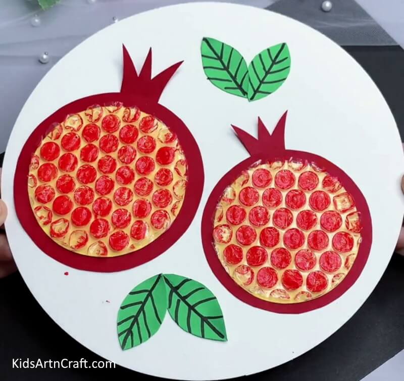 Construct a pomegranate craft with bubble wrap printing For Children
