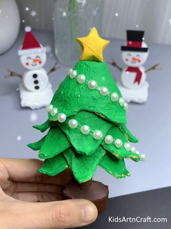 Adding Decorative Items - Step-by-Step Guide for Kids on Crafting a Christmas Tree from an Egg Carton