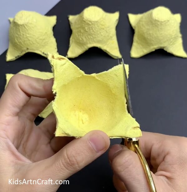 Cutting The Egg Carton In A Tree Shape - An Easy Tutorial for Kids to Make a Christmas Tree from an Egg Carton