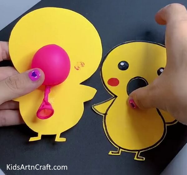 Placing Balloon  - Make a Balloon Chicken Craft With These Detailed Instructions