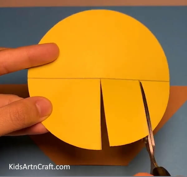 Cutting the Segments of Yellow Circle - Homemade Bird Nest From Paper 