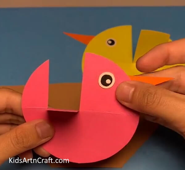 Pasting Eyes And Beak - Bird's Nest Art Made From Paper 