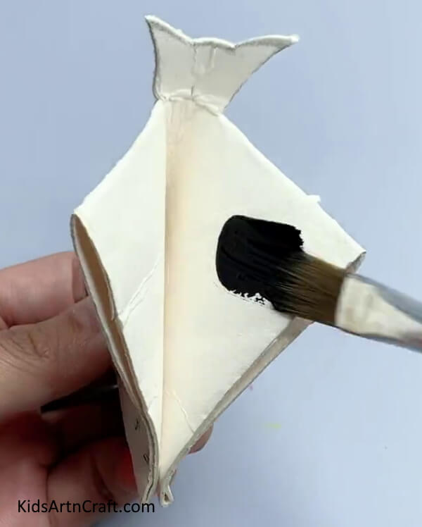Painting The Bat Black - Instructions on How to Make a Bat from a Reused Cardboard Tube