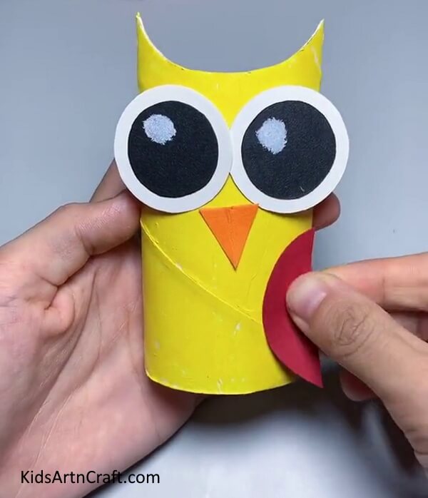 Pasting Wings and Nose - Crafting an Owl From Recycled Cardboard Tubes For Kids