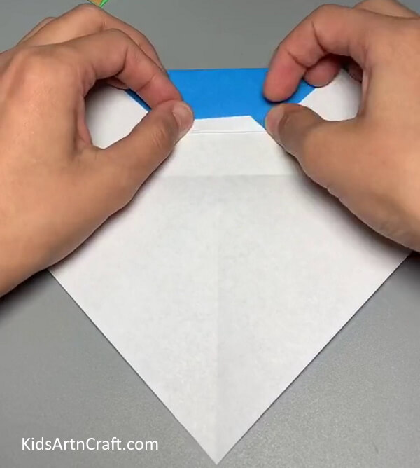 Make Smaller Folds-Design a festive Santa Claus project using paper. 