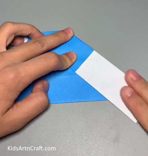 Folding To Make Perfect Slopes- Put together a paper Santa craft for the kids this Christmas. 