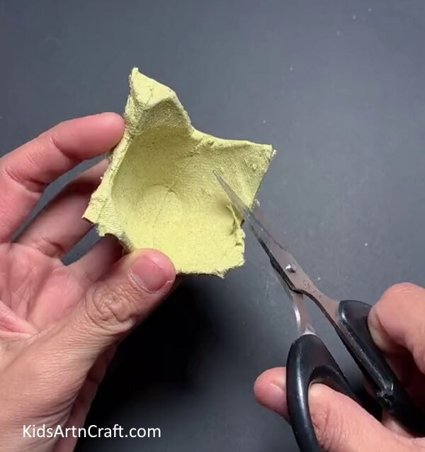 Cutting Out An Egg Holder- Children can make their own egg carton dinosaurs.
