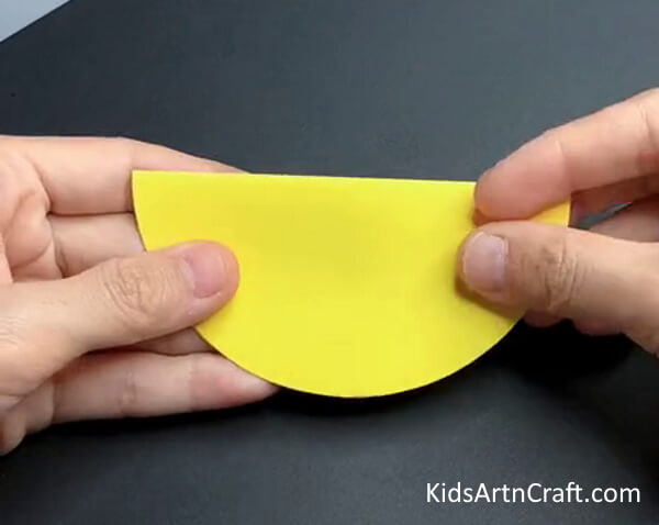 Folding The Circle In Half- Put Together a Fun Paper Chicken Creation For Children 