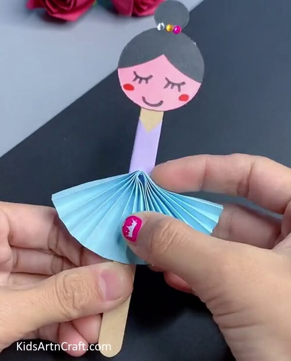 Pasting The Skirt To The Body Of The Ballerina-Make a Ballerina Craft Using Paper