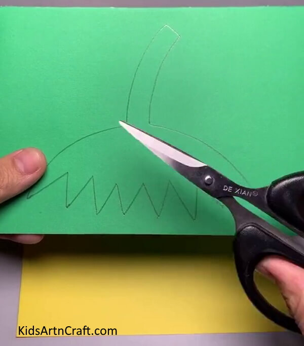 Cutting Leaf Out Of Paper - Learn to put together a Strawberry craft out of Paper