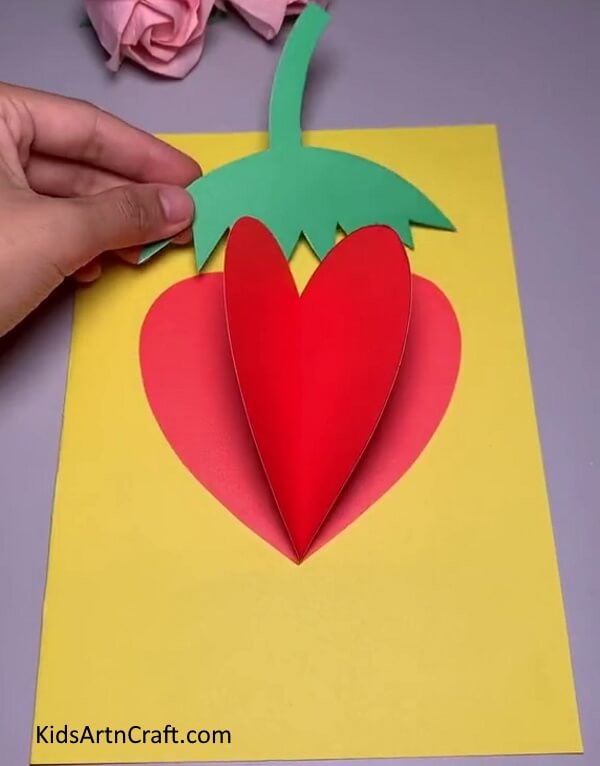 Pasting Leaf On Strawberry - Master the ability of making a Strawberry craft with Paper