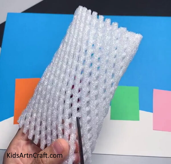 Cutting Foam In Triangular Shape - Home-Based Foam Net Art with Fruity Accents