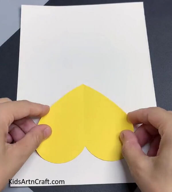 Pasting A Yellow Heart - A Valentine's Day Art Project in the Form of a Heart-Shaped Cat