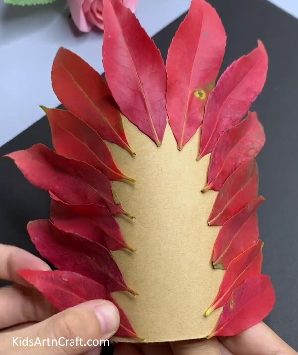 Cover Edges With Red Leaves - Constructing a Hedgehog Leaf Creation - Ideal For Kindergarteners!