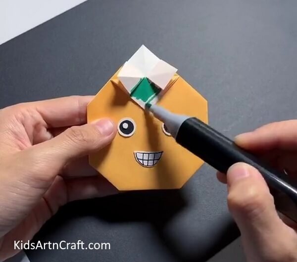 Color The Top Folded Portion-Crafting paper into origami fruit for kids. 