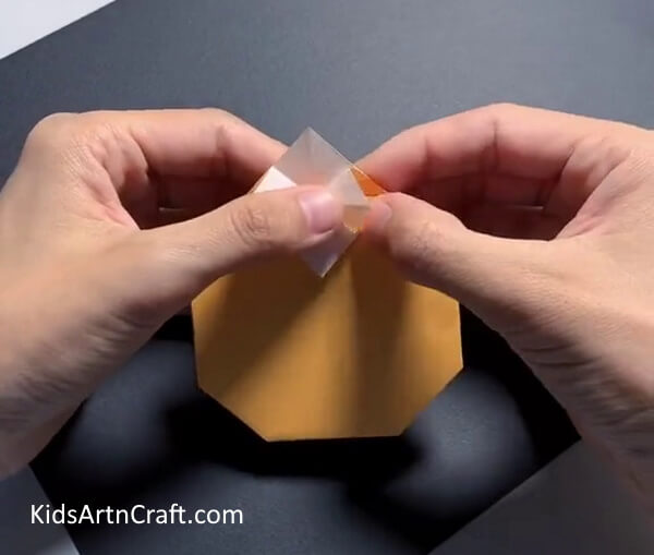 Take The Folded Portion Up And Then Press On The Crease Formed-Fabricating Origami Fruit with Craft Paper for Tots