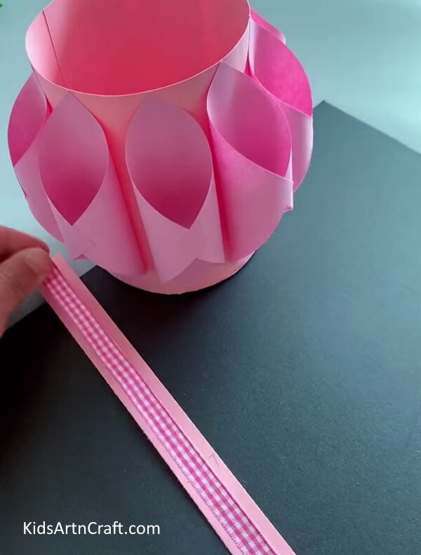 Pasting Ribbon On Pink Strip - Create a simple paper basket with supplies you have at home.