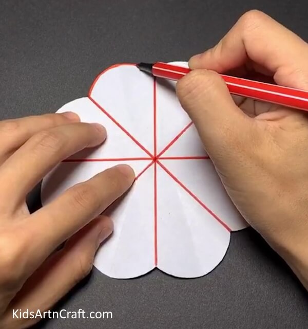 Drawing The Outlines- Creating a paper flower craft with your kids 