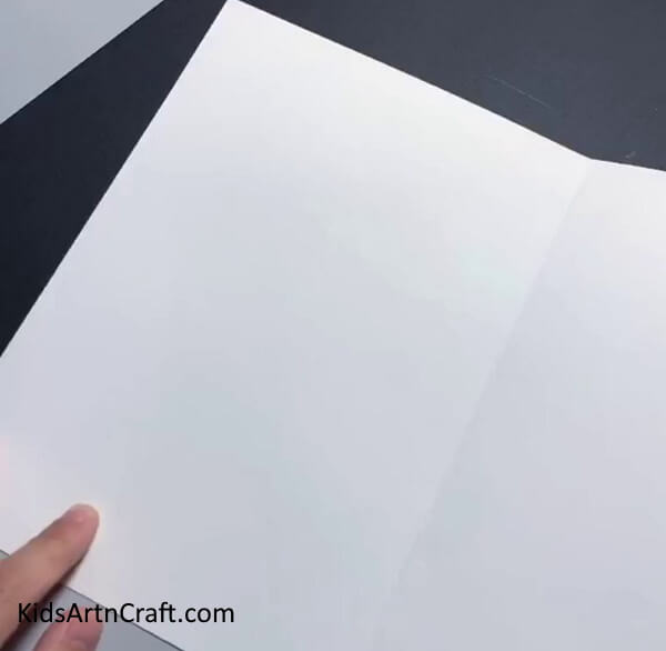 Folding The White Sheet- Here is a how-to guide for children to make their own paper masks. 